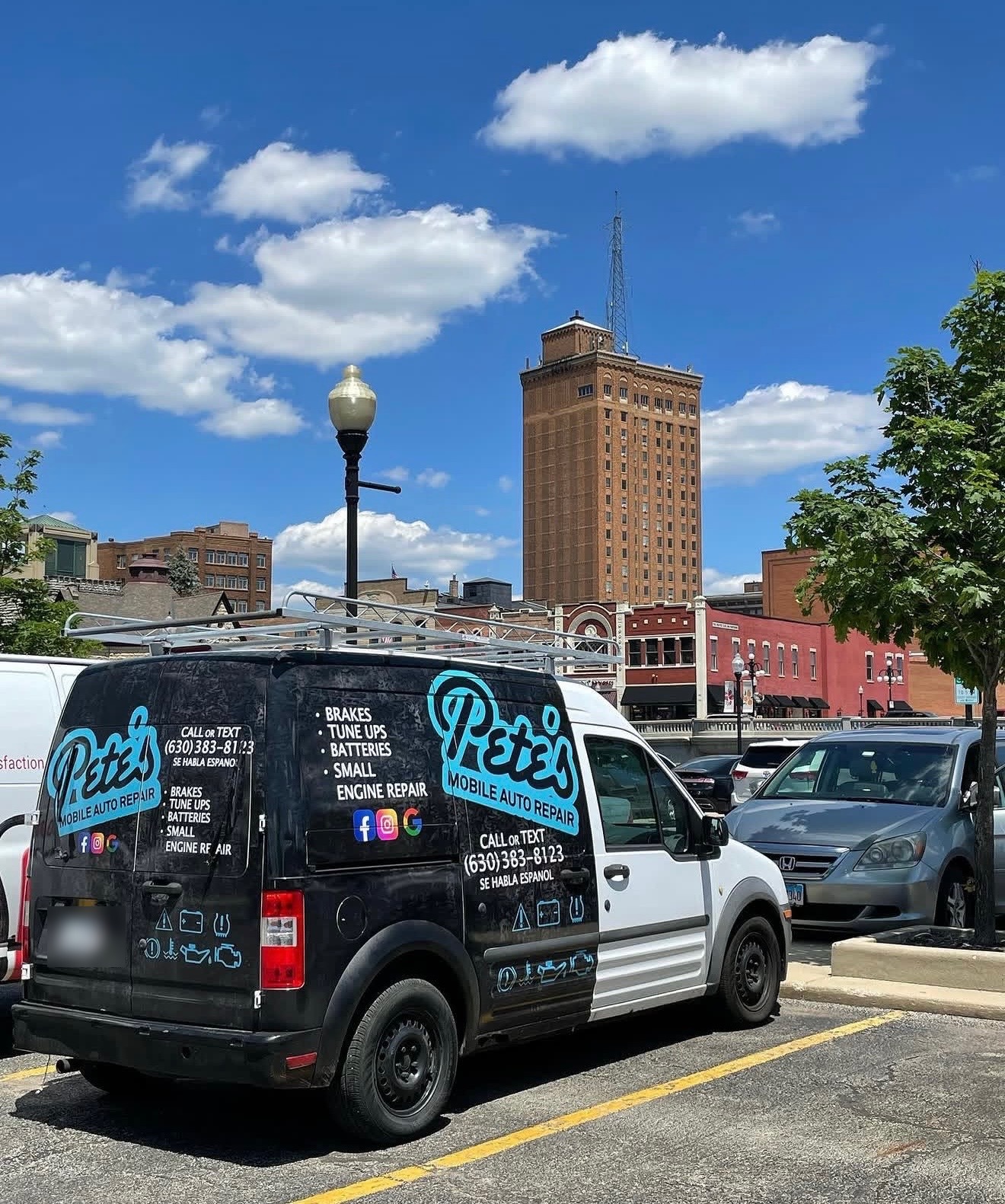 Pete's Mobile Auto Repair service van parked in downtown Aurora, Illinois